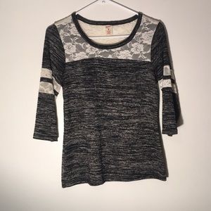 Black half sleeve shirt with white lace detailing.